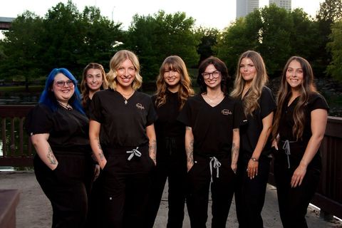 The SpaHub Tulsa team together outdoors at golden hour